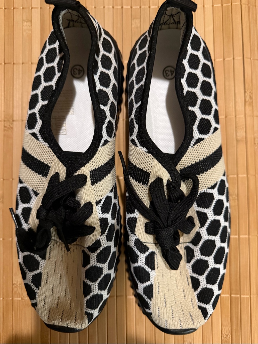 Women’s Black and Cream Knit Slip-On Sneakers